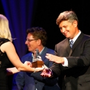 Eric Gibson accepts one of many Gibson Brothers trophies at the 2011 IBMA Awards show - photo © Dean Hoffmeyer