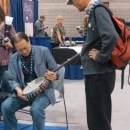 Examining a Deering banjo at WOB 2012 - photo by Woody Edwards