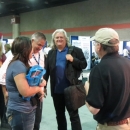 Kenny and Amanda Smith and Ricky Skaggs chatting with Terry Herd  at the Bluegrass Today booth at WOB 2012 - photo by Woody Edwards