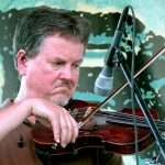 Mike Hartgrove with Lonesome River Band at ROMP 2012 - photo by Terry Herd