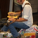 Chad Graves warming up before the Slidegras Extravaganza at World of Bluegrass 2012 - photo by David Morris