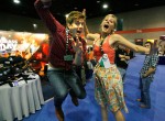 Jens Koch and Nora Jane Struthers do the obligatory "jump pose" at IBMA 2011 - photo © Dean Hoffmeyer Jens Koch and Nora Jane Struthers do the obligatory "jump pose" at IBMA 2011 - photo © Dean Hoffmeyer
