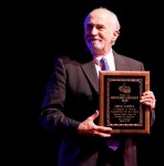 Greg Cahill accepts his Distinguished Achievement Award at IBMA 2011 - photo © Dean Hoffmeyer Greg Cahill accepts his Distinguished Achievement Award at IBMA 2011 - photo © Dean Hoffmeyer
