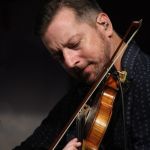 Jason Carter with The Travelin' McCourys at the August 2016 Gettysburg Bluegrass Festival - photo by Frank Baker