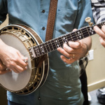Tony Trischka and Bill Evans doing four handed banjo backstage at the 2013 California Banjo Extravaganza - photo by Mike Melnyk