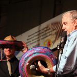 MC Bob Webster tries to distribute sombreros for Cinco de Mayo at the 2016 Doyle Lawson & Quicksilver Bluegrass Festival - photo © Laura Tate Photography