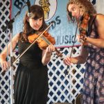 Stephanie Coleman and Rayna Gellert with Uncle Earl at the 2016 Delaware Valley Bluegrass Festival - photo by Frank Baker