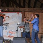 Caleb Cox and Mitchell Davis dance while Chris Sexton fiddles with Nothin' Fancy at the August 2016 Gettysburg Bluegrass Festival - photo by Frank Baker