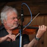 Rickie Simpkins with Seldom Scene at the August 2016 Gettysburg Bluegrass Festival - photo by Frank Baker