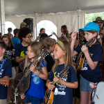Kids learn that picks stick to your forehead at Kids Academy at the 2016 Grey Fox festival - photo © Tara Linhardt