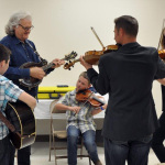Ricky Skaggs rehearsing backstage with Presley Barker, Carson Peters, and Kitty Amaral at HoustonFest 2016 - photo by Keith Brown