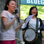 Alisa Inaba, Master of ceremonies welcomes an act to the stage at KazCamp 2016