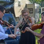 Becky Buller Band rehearsing triple fiddles for Southern Flavor at the 2016 Milan Bluegrass Festival - photo © Bill Warren