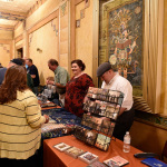 Heather and Tony Mabe working their merch table at the Remembering Miss Dixie taping at Song of the Mountains (May 7, 2016) - photo by David Johnson