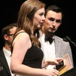 Kelsi Harrigill with Flatt Lonesome accepting their Vocal Group of the Year trophy at the 2016 International Bluegrass Music Awards - photo by Frank Baker
