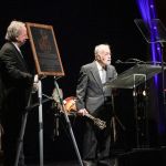 Roland White accepting his brother Clarence's induction at the 2016 International Bluegrass Music Awards - photo by Frank Baker