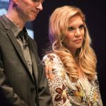 John Virant and Alison Krauss speak during the Hall of Fame induction for Rounder Records founders at the 2016 International Bluegrass Music Awards - photo by Frank Baker