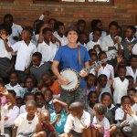 Ross Nickerson with South African schoolchildren during a visit from the 2012 Banjo Safari crew - photo by Kevin Dooley