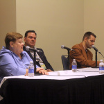 Katy Daley holds forth with Joe and Daniel Mullins at World of Bluegrass 2015 - photo by Becky Johnson