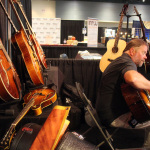 Checking out guitars at World of Bluegrass 2015 - photo by Becky Johnson