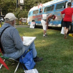 Artist sketching The Bluegrass Bus at Thomas Point Beach - August 2012