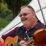 Eddie Gill warming up with Big Country Bluegrass at the 2016 Miami Valley Brewfest - photo by Stacey Wright