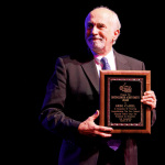 Greg Cahill accepts his Distinguished Achievement Award at IBMA 2011 - photo © Dean Hoffmeyer