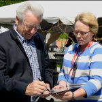 Del McCoury signs an autograph for Gina Proulx at DelFest 2013 - photo © G. Milo Farineau
