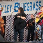 Tina Adair and Dale Ann Bradley sitting in with Ricky Skaggs & Kentucky Thunder at the 2016 Delaware Valley Bluegrass Festival - photo by Frank Baker