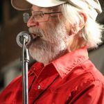 Bill Foster serves as MC at the 2016 Delaware Valley Bluegrass Festival - photo by Frank Baker