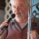 Rickie Simpkins with Seldom Scene at the 2016 Delaware Valley Bluegrass Festival - photo by Frank Baker