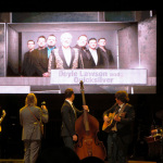 Doyle Lawson & Quicksilver on the big screen as The Roys prepare to open the 2012 ICM Awards show - photo by Sherri George