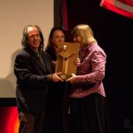 Jean-Michel Peyro accepts the 2015 European Bluegrass Pioneer Award for Jean-Marie Redon (3/14/15) - photo by Robert Bowe