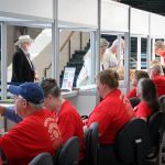 Volunteers at the registration booth at the songwriting seminar at World of Bluegrass 2016 - photo by Frank Baker