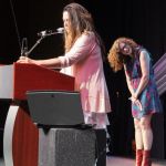 Becky Buller laughs as Donna Ulisse accepts her Songwriter of the Year Award at World of Bluegrass 2016 - photo by Frank Baker Union