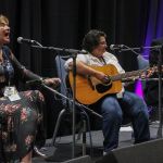 Valerie Smith, Dawn Kenney, and David Morris sing in a songwriter showcase at Wide Open Bluegrass 2016 - photo by Frank Baker
