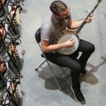 Wes Corbett checking out a banjo in the Exhibit Hall during Wide Open Bluegrass 2016 - photo by Frank Baker