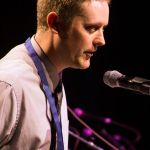 Jake Workman accepts his Momentum Award at World of Bluegrass 2016 - photo by Frank Baker