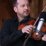 Jason Carter with The Travelin\' McCourys at the Gettysburg Bluegrass Festival (August 2014) - photo by Frank Baker
