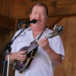 Lou Reid with Seldom Scene playing John Duffey\'s old mandolin at the Gettysburg Bluegrass Festival (August 2014) - photo by Frank Baker