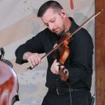Jason Carter with The Travelin' McCourys at the August Gettysburg Bluegrass Festival - photo by Frank Baker