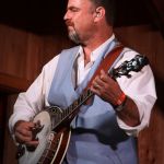 Rob McCoury with The Travelin' McCourys at the August Gettysburg Bluegrass Festival - photo by Frank Baker