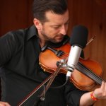 Jason Carter with Travelin' McCourys at the August 2013 Gettysburg Bluegrass Festival - photo by Frank Baker