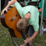 Pick in the soundhole at the 2015 Grey Fox Bluegrass Festival - photo © Tara Linhardt