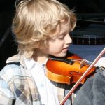 Young fiddler enjoying his time at HoustonFest 2014 - photo by Jordan Laney