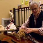Bass repair in the lobby at the 2016 Joe Val Bluegrass Festival - photo © Tara Linhardt