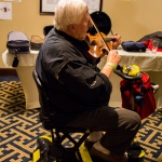 Fiddler on the move at the 2016 Joe Val Bluegrass Festival - photo © Tara Linhardt