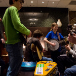Young pickers jamming in the lobby at the 2016 Joe Val Bluegrass Festival - photo © Tara Linhardt