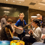Young pickers jamming in the lobby at the 2016 Joe Val Bluegrass Festival - photo © Tara Linhardt