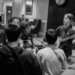 Young pickers jamming in the lobby at the 2016 Joe Val Bluegrass Festival - photo © Tara Linhardt